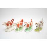 Four early 20th C Staffordshire cow creamer figures.