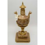A variegated brown marble and giltmetal lamp base, of classical urn form, 50cms high.