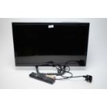 Seiki flatscreen television and remote.