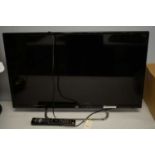 JVC 32in. flatscreen TV and remote.