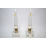 Pair of white obelisks in Regency style.