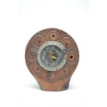 An aneroid barometer set into the wooden propeller boss from an F.E.2b WWI aeroplane.