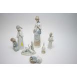 Lladro figures and four other figures.