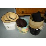 Three bowler hats and two boxes.