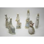 Lladro figure; and five Nao and other Lladro style figures.