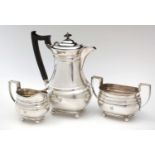 Silver matching hot water jug, milk jug and two-handled sugar bowl