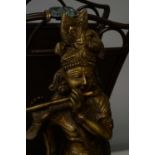 Repro Indian brass deity; magazine rack; and Asian stand.