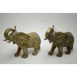Pair of modern cast brass African elephants.