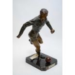 A cast spelter football figure