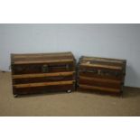 Two early 20th C domed trunks.