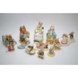 Twelve Beatrix Potter figures.