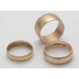 Three gold wedding bands