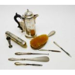 Early 20th C silver hot water jug; and various other dressing table items.