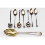 Set of six silver teaspoons; and other spoons.