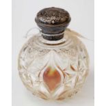 Silver-mounted cut-glass scent bottle.