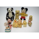 Mickey Mouse and other teddy bears.