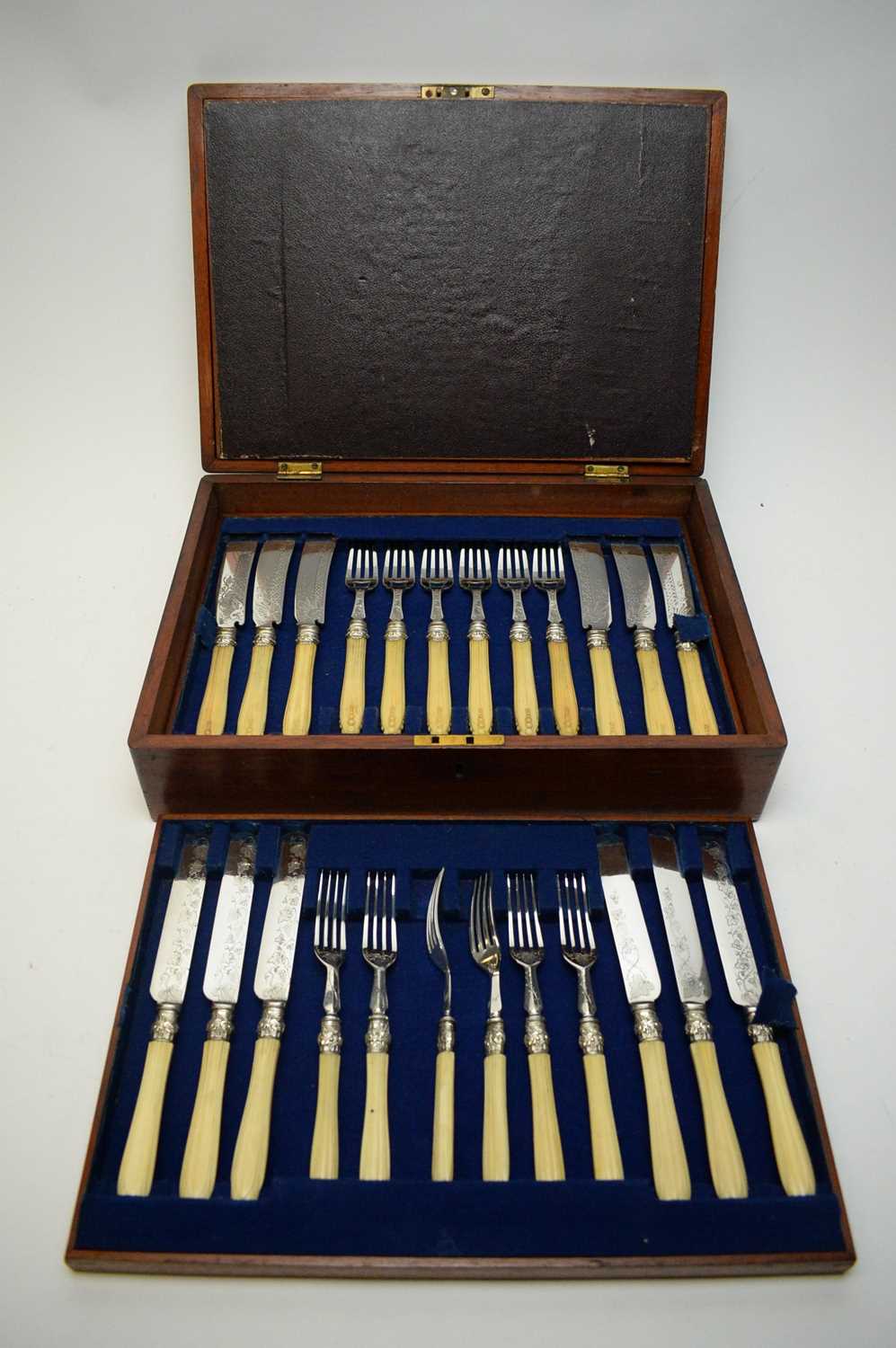 A set of fish knives and forks and six fruit knives and forks