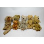 Seven vintage teddy bears; and a pyjama case.