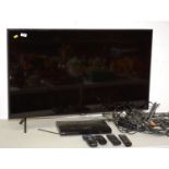 Samsung 42in. TV, Sony DVD player and remotes.