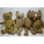 Four vintage teddy bears.