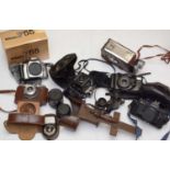 A quantity of cameras and camera equipment