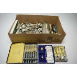 Assorted EPNS cutlery and flatware in a box.
