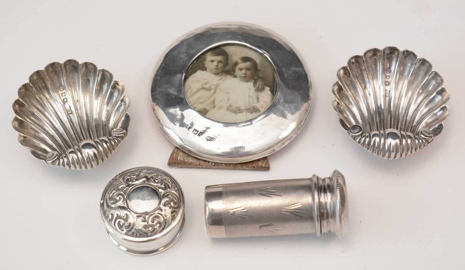 Miniature silver items, to include: a pair of shell pattern table salts, by E.G., Birmingham 1896; a