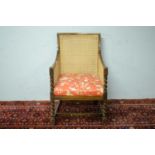 A late 19th Century oak bergere chair