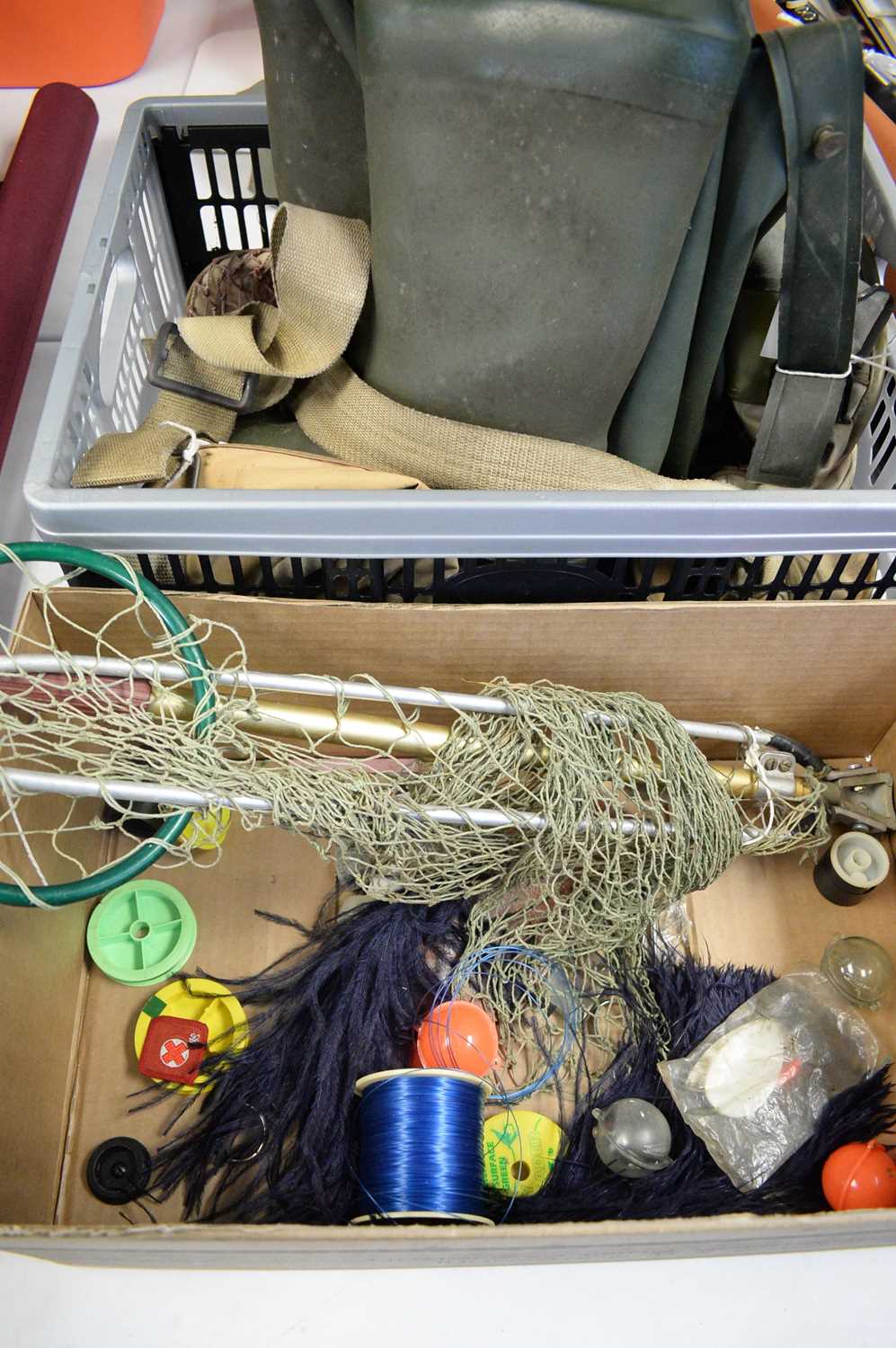 A collection of miscellaneous fishing gear / A collection of fishing books