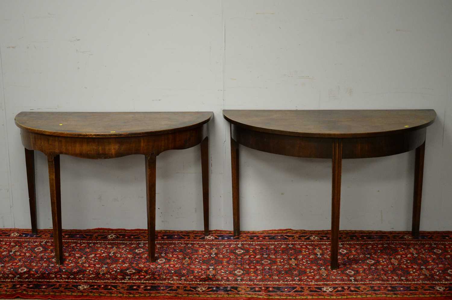 Two 19th C mahogany demi lune side tables.