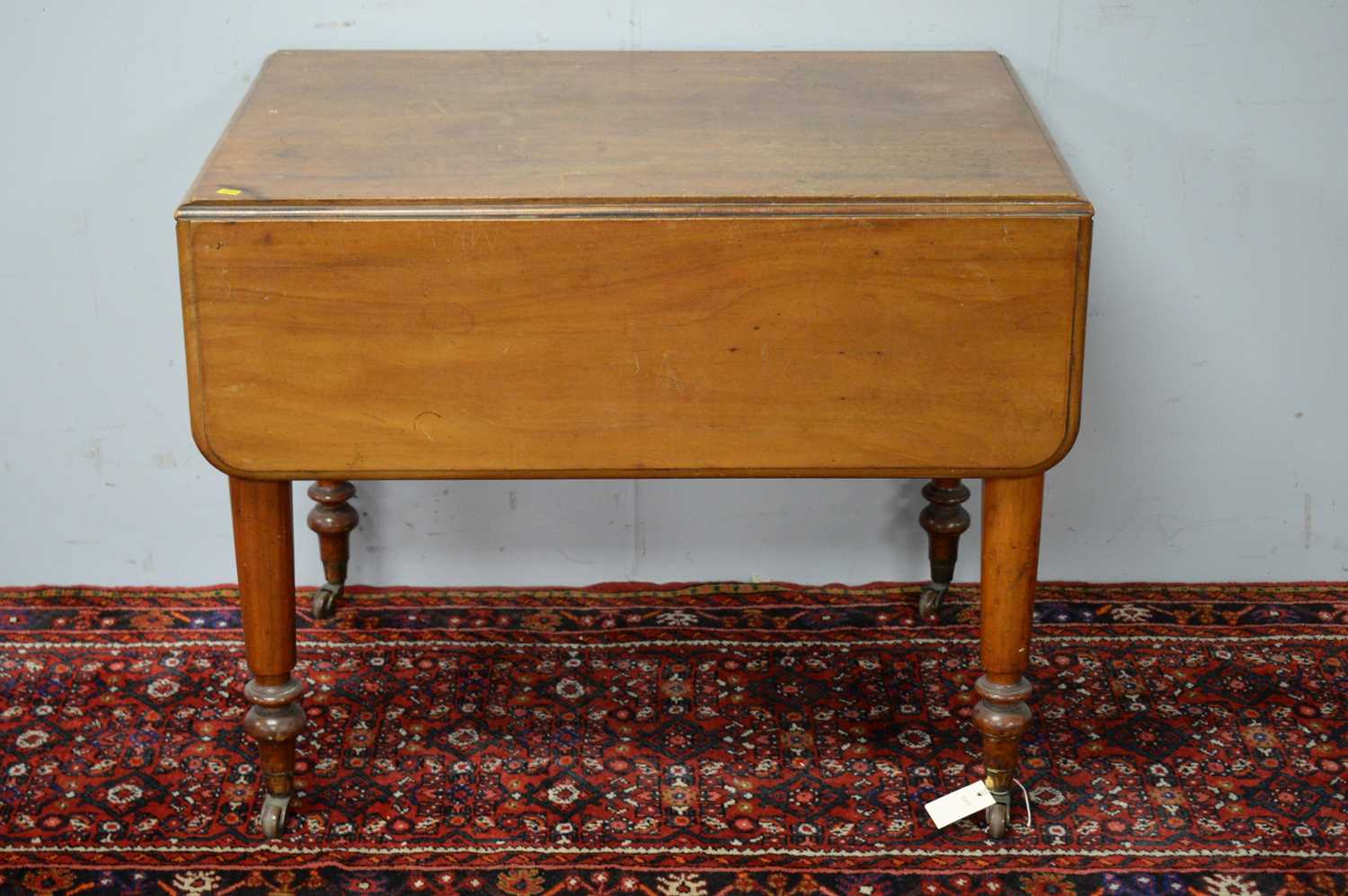 Victorian walnut drop leaf dining table.