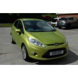 A green Ford Fiesta.