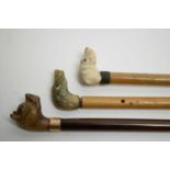 Three early 20th C swagger sticks.