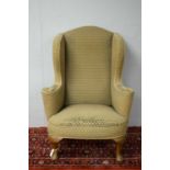 Early 20th C wing back armchair.