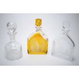 Three glass decanters.