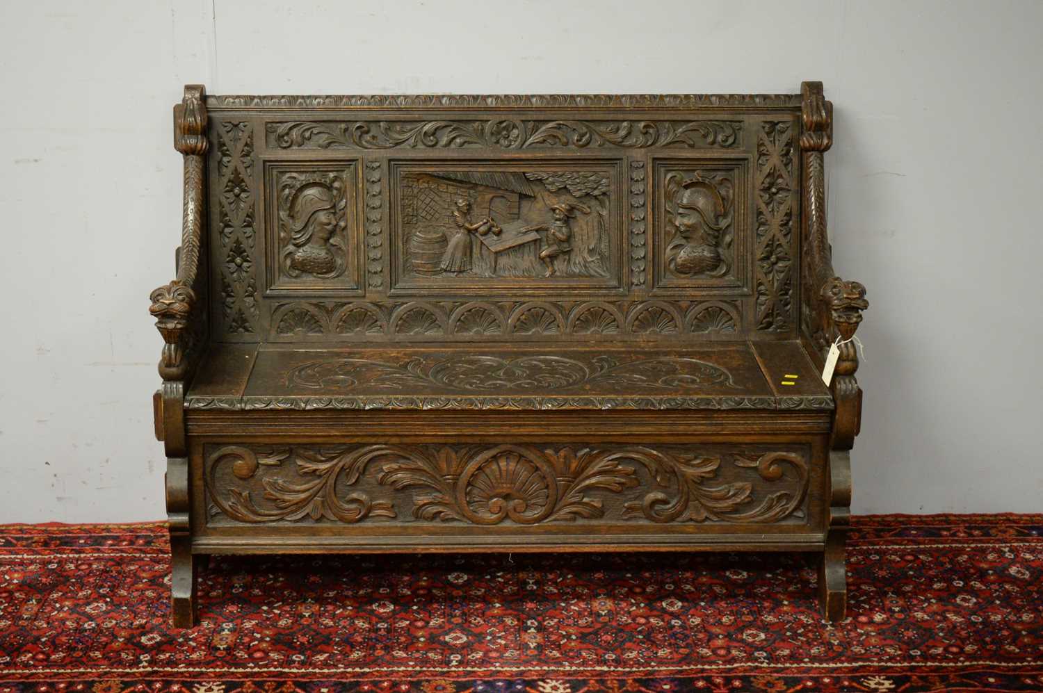 Early 20th C carved oak settle.