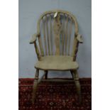 A late 19th Century ash and elm Windsor chair, hoop top rail with pierced and spindle back above