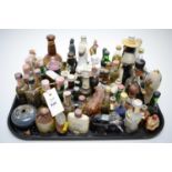 A selection of miniature whiskeys, miniature whiskey decanters and other items.