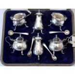 Six-piece silver condiment set.