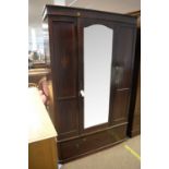 An Edwardian mahogany wardrobe.