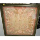 A framed embroidered panel, the central rounded square colourful section within a border of foliage,