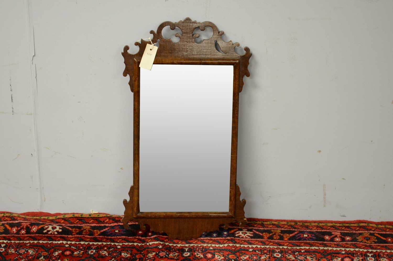 20th C George III style mahogany fret carved wall mirror.