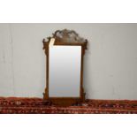 20th C George III style mahogany fret carved wall mirror.