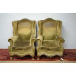 Pair of early 20th C wing back armchairs.