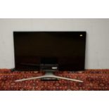 Two Samsung flat screen televisions.