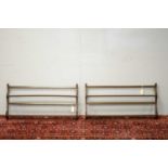 Pair of 20th C Ercol elm hanging shelves.