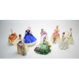 Eight Royal Doulton figurines.