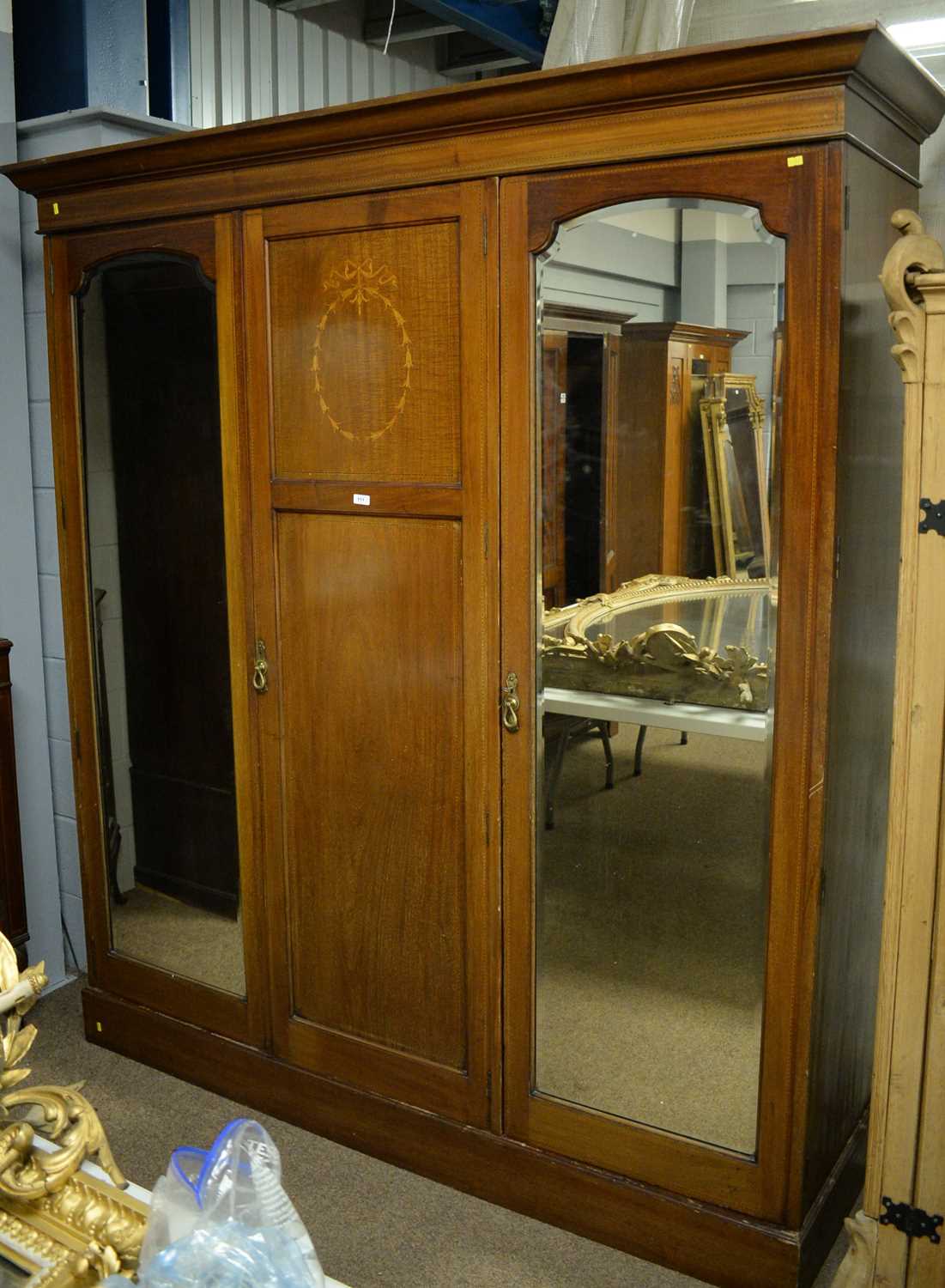 Early 20th Century mahogany three-door wardrobe.