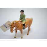 Beswick model of a young boy hunter.