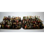 Large collection of miniature bottles of alcohol.